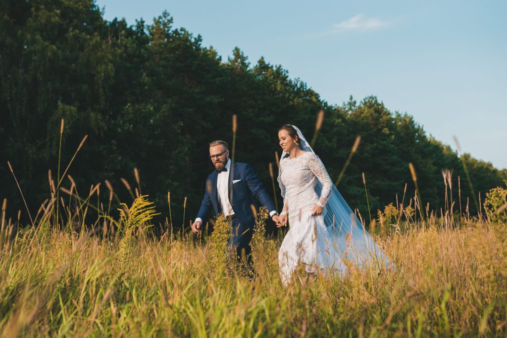 groom runs with his wife