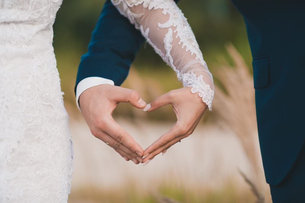 married couple heart hands