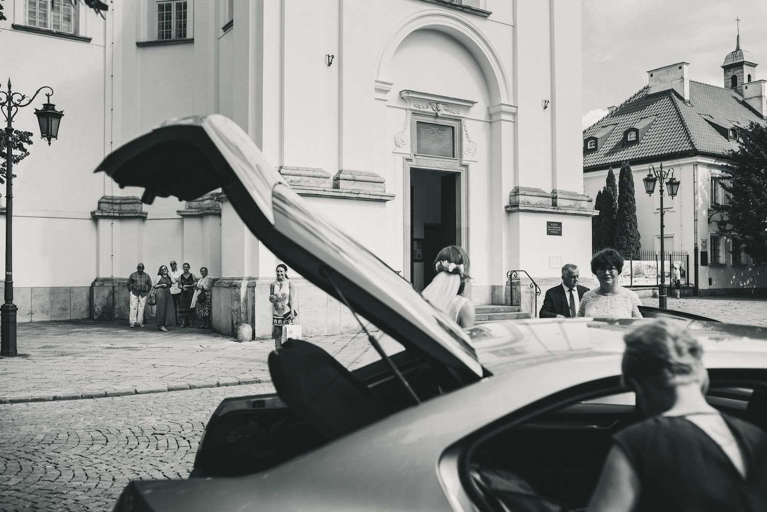 black and white car guests wedding church