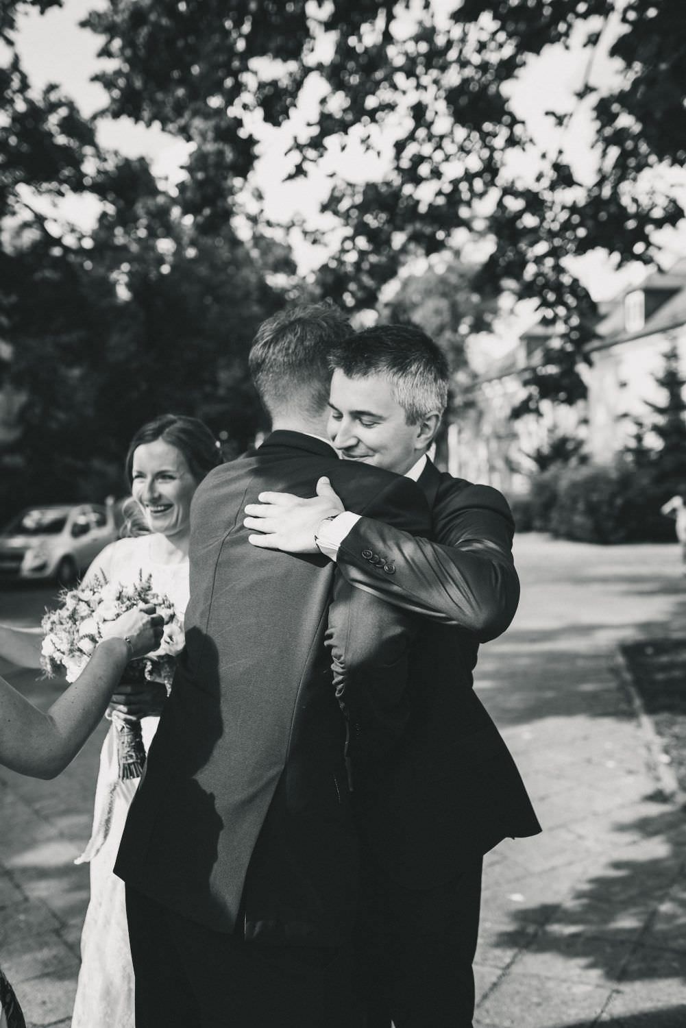 black and white groom receive wishes
