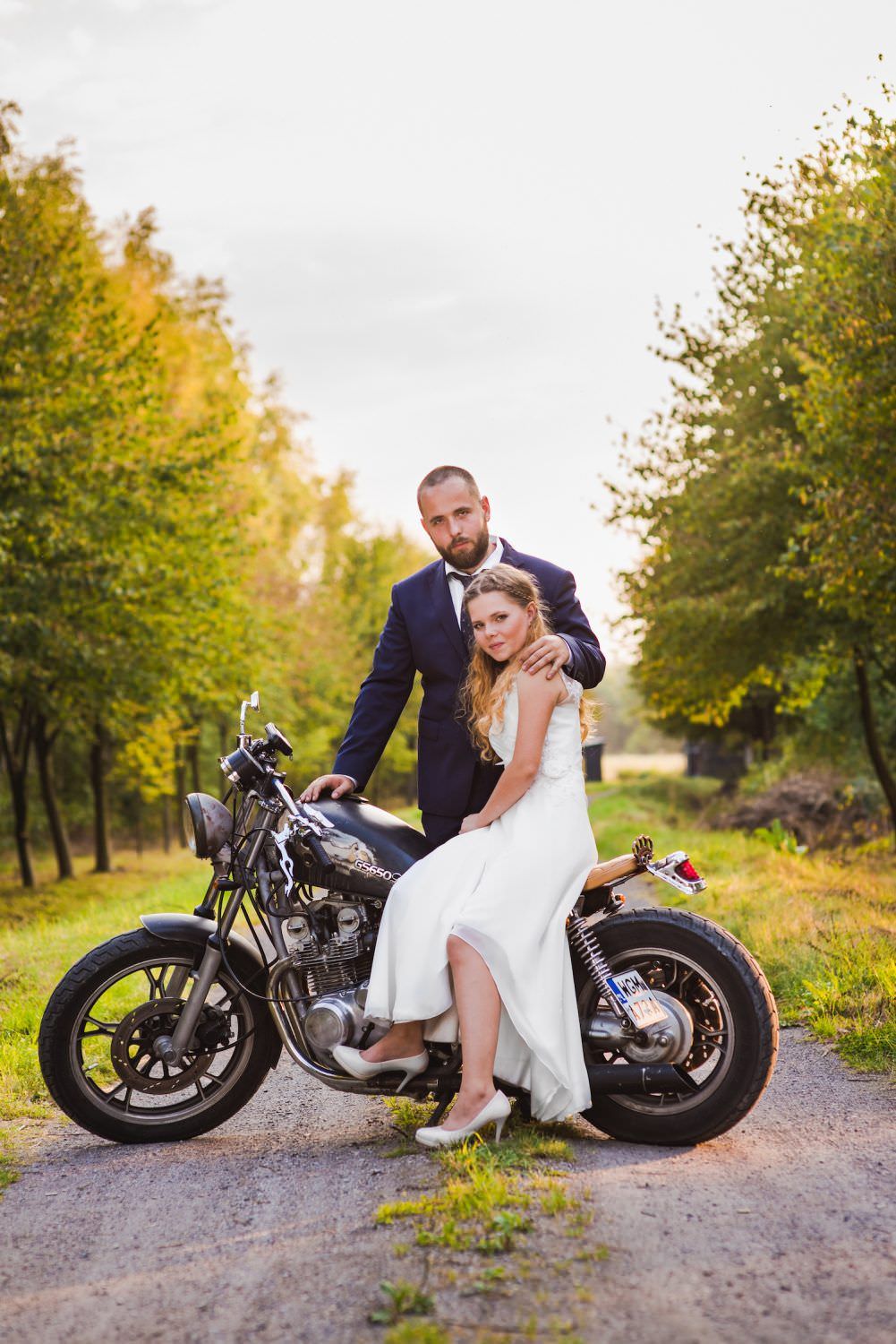 bride and groom on the motorbike nature portrait photography