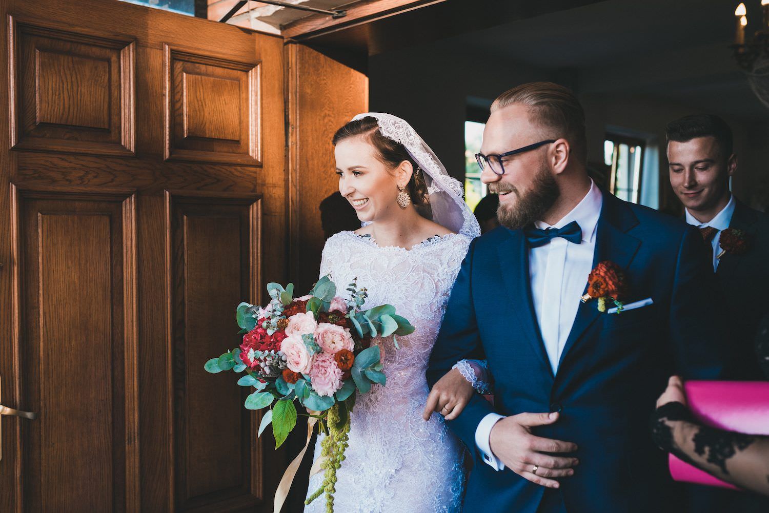 bride and groom go out the church