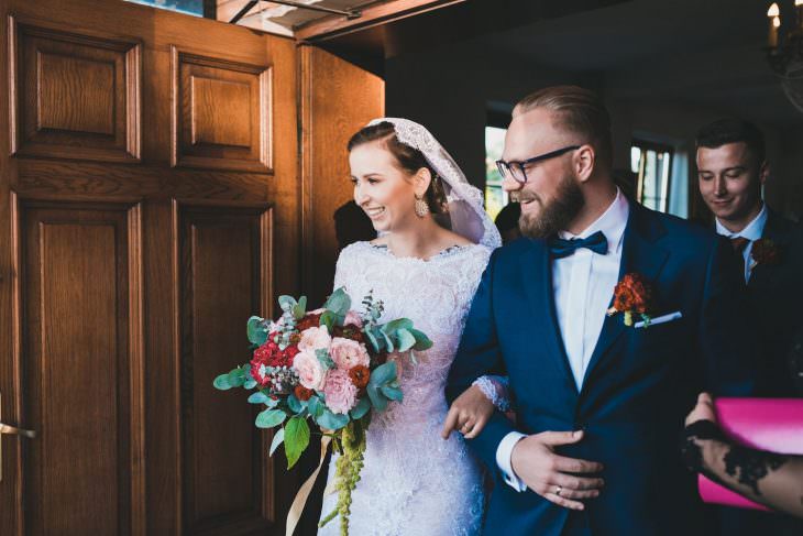 bride and groom go out the church