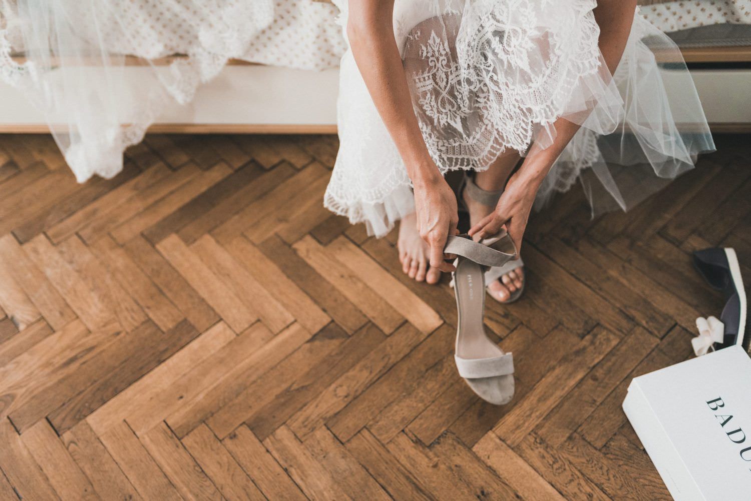 bride wearing shoes wooden floor
