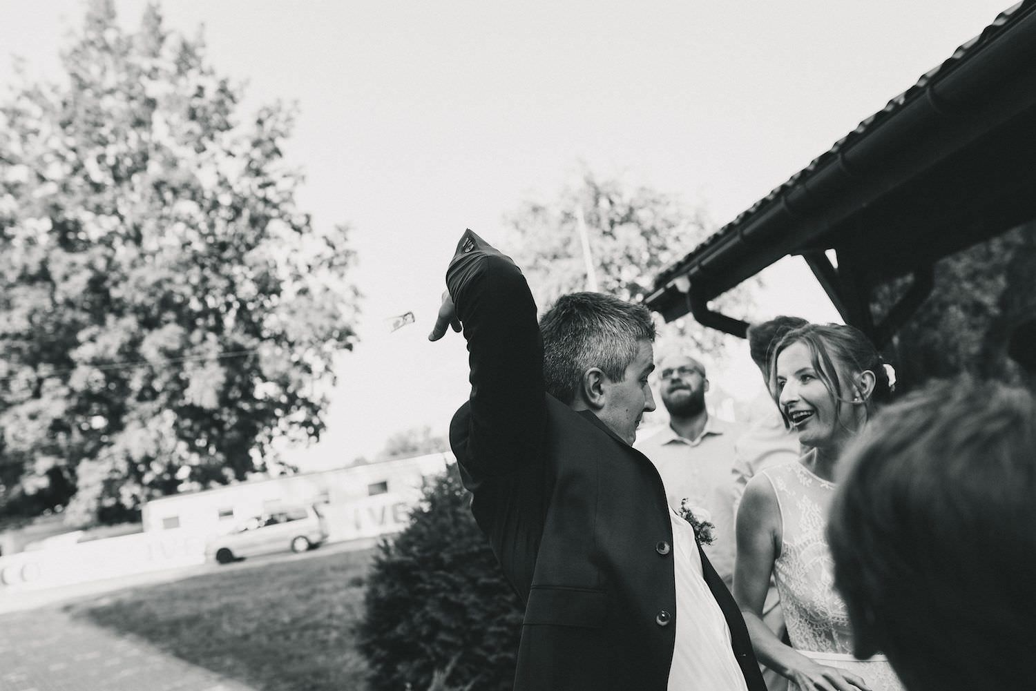 groom and bride throw back their glasses