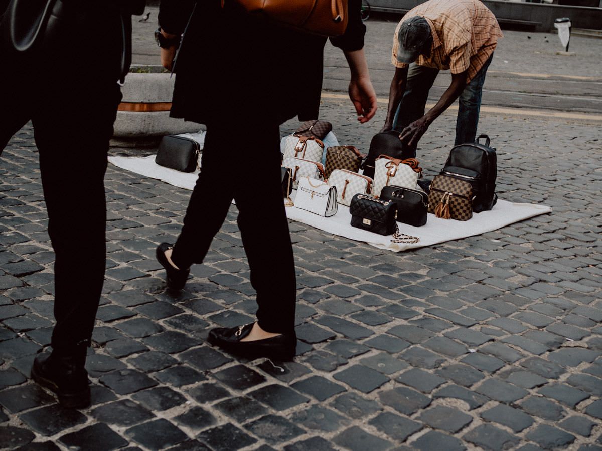 Man selling fake bags on the street in Italy