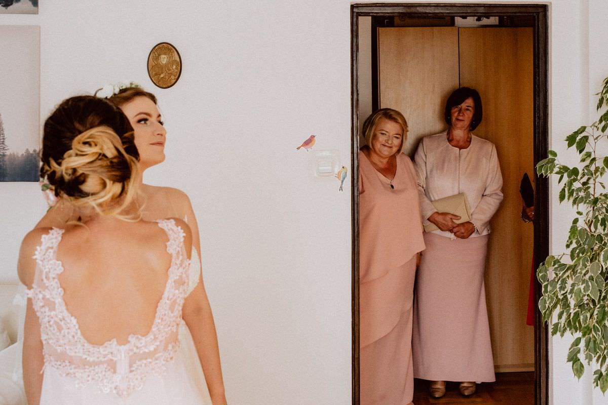 the bridesmaid prepares the bride for the wedding