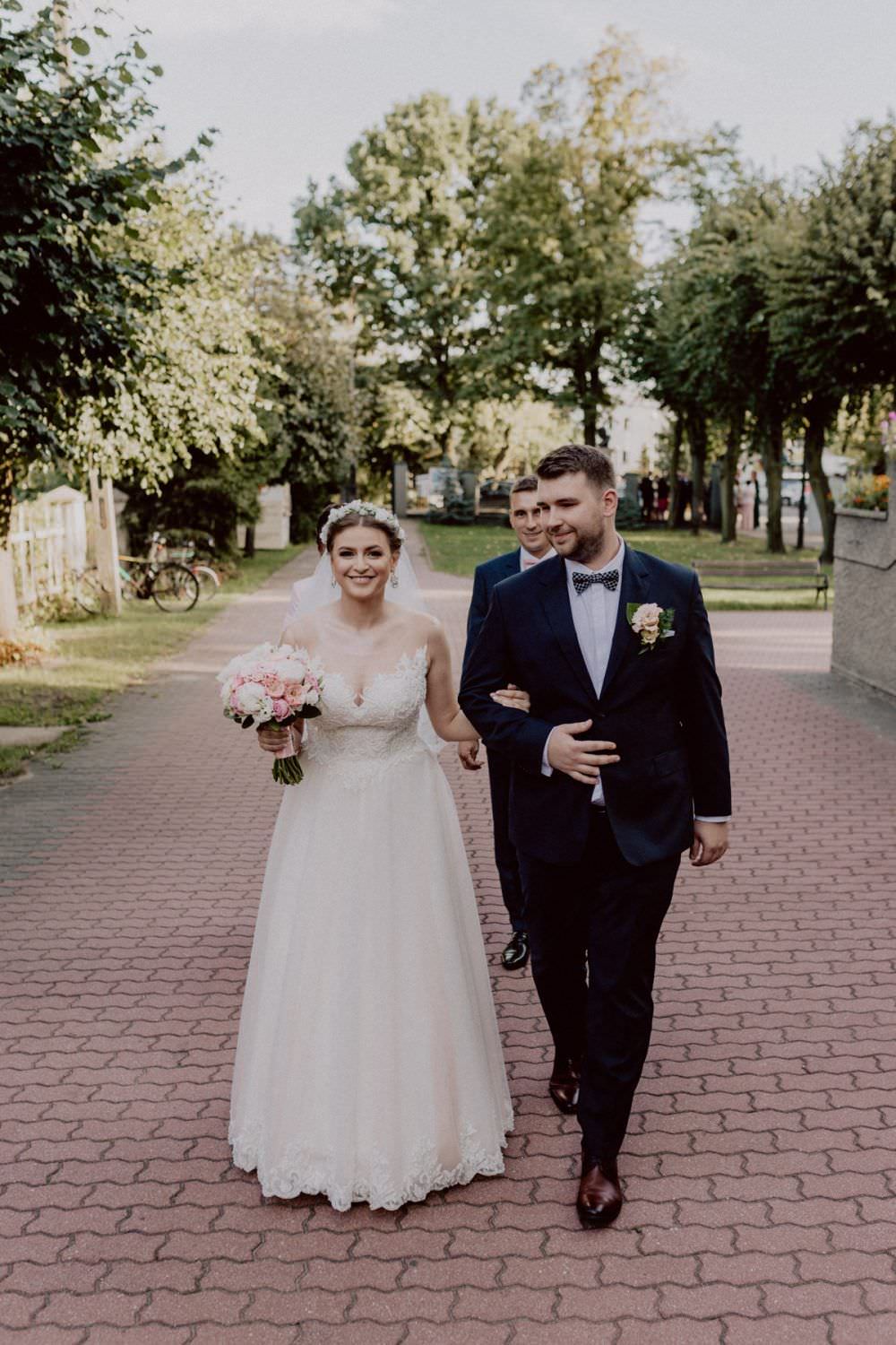 married couple goes to the church