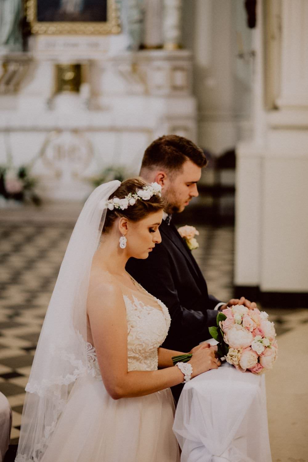 bride and groom in front of the altar