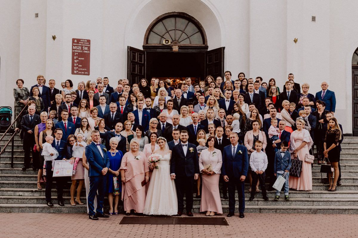 group photo in front of the church on wedding