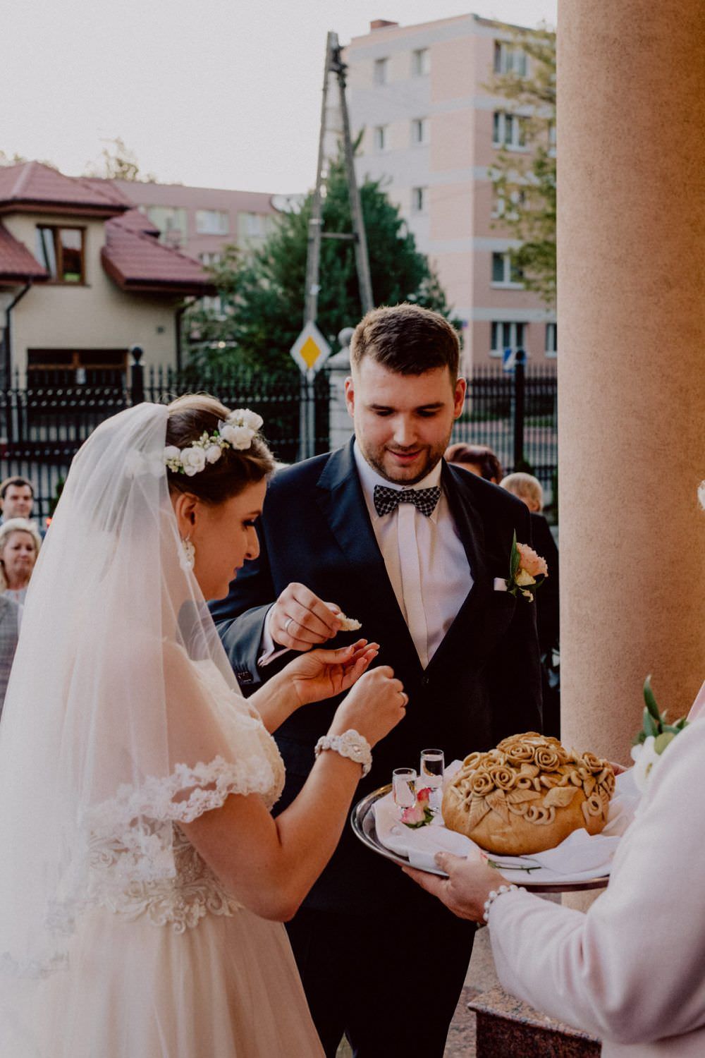 bride and groom eats the bread