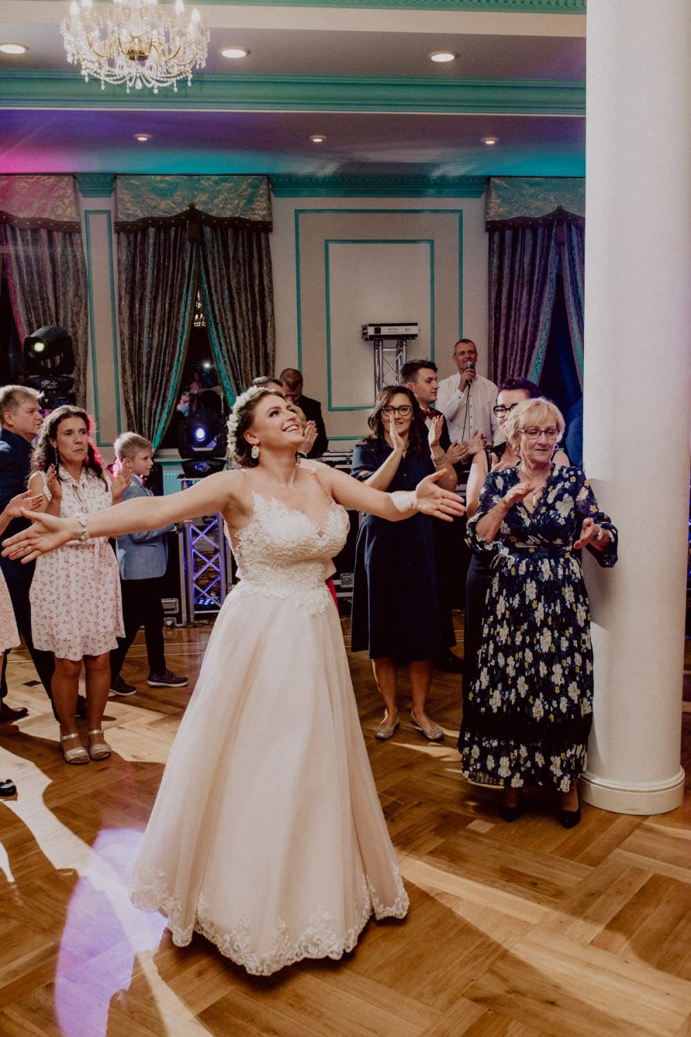 bride with arms spread wide