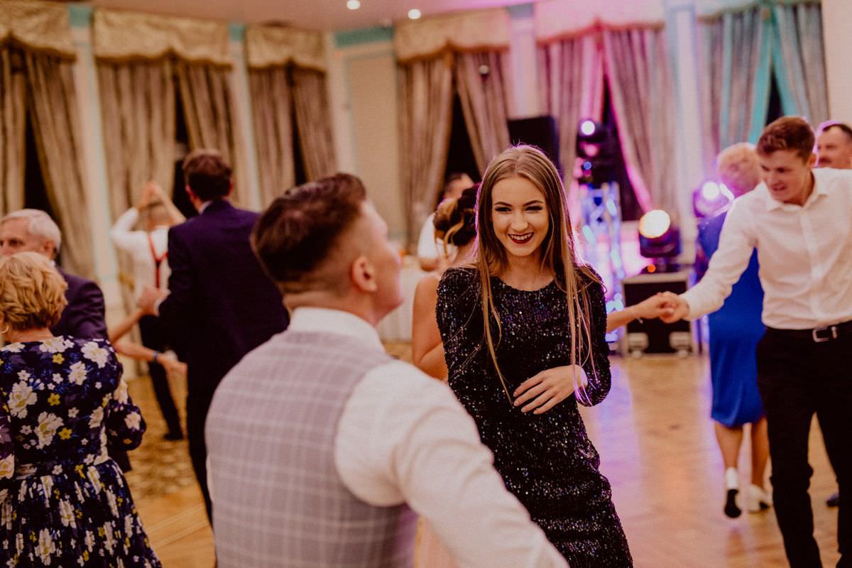woman dance with man on dance floor on wedding party