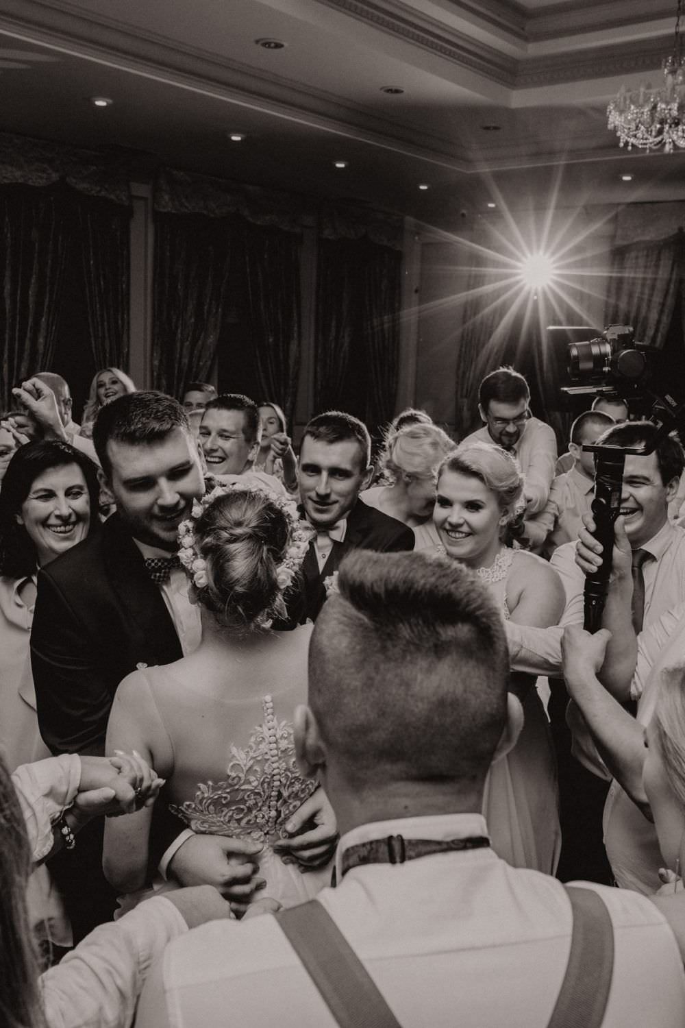 bride and groom round the people