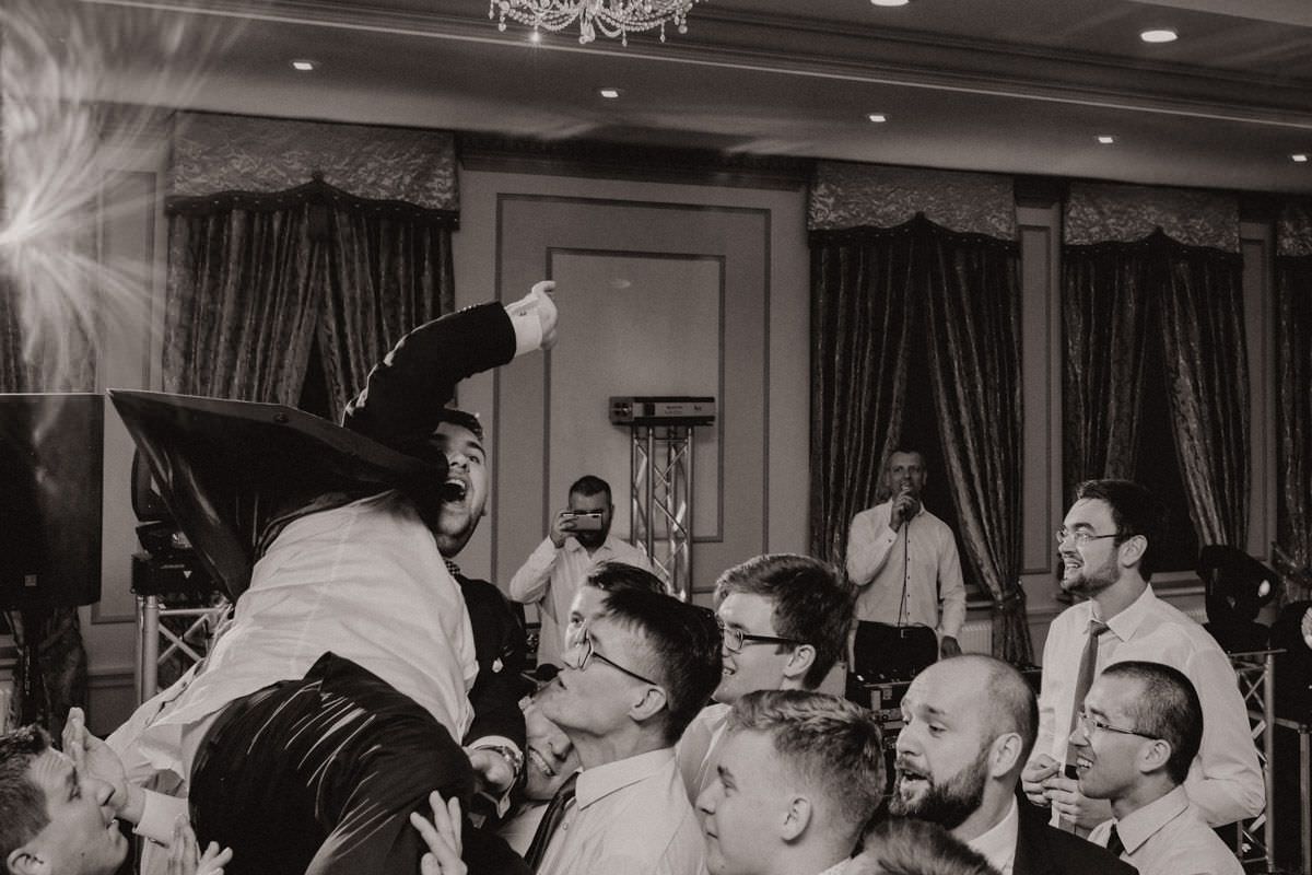 mans on the wedding party throw up the bride