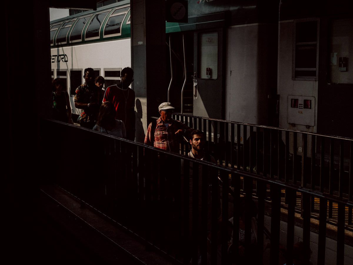 people entering the underground passage at the station
