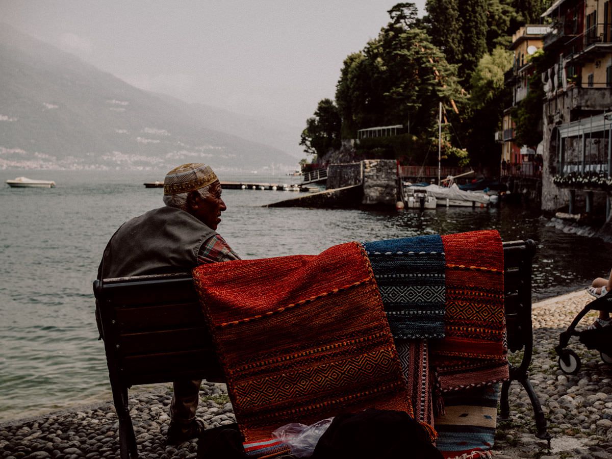 Old man on the bench in Vienna on como lake